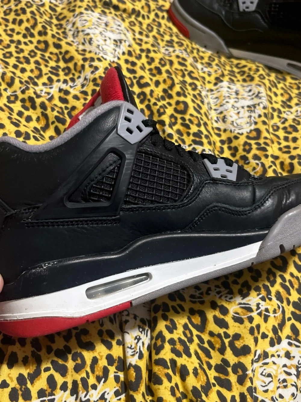 Jordan 4 Men’s Black, Gray and Red Retro Sneakers